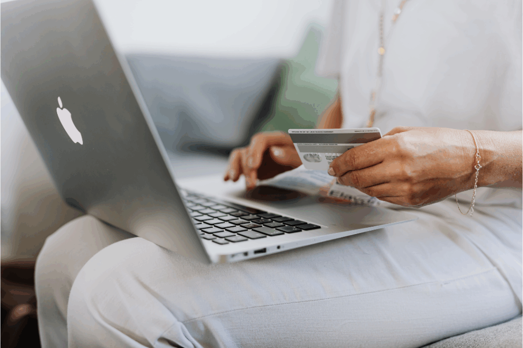 Woman on computer with Credit Card
