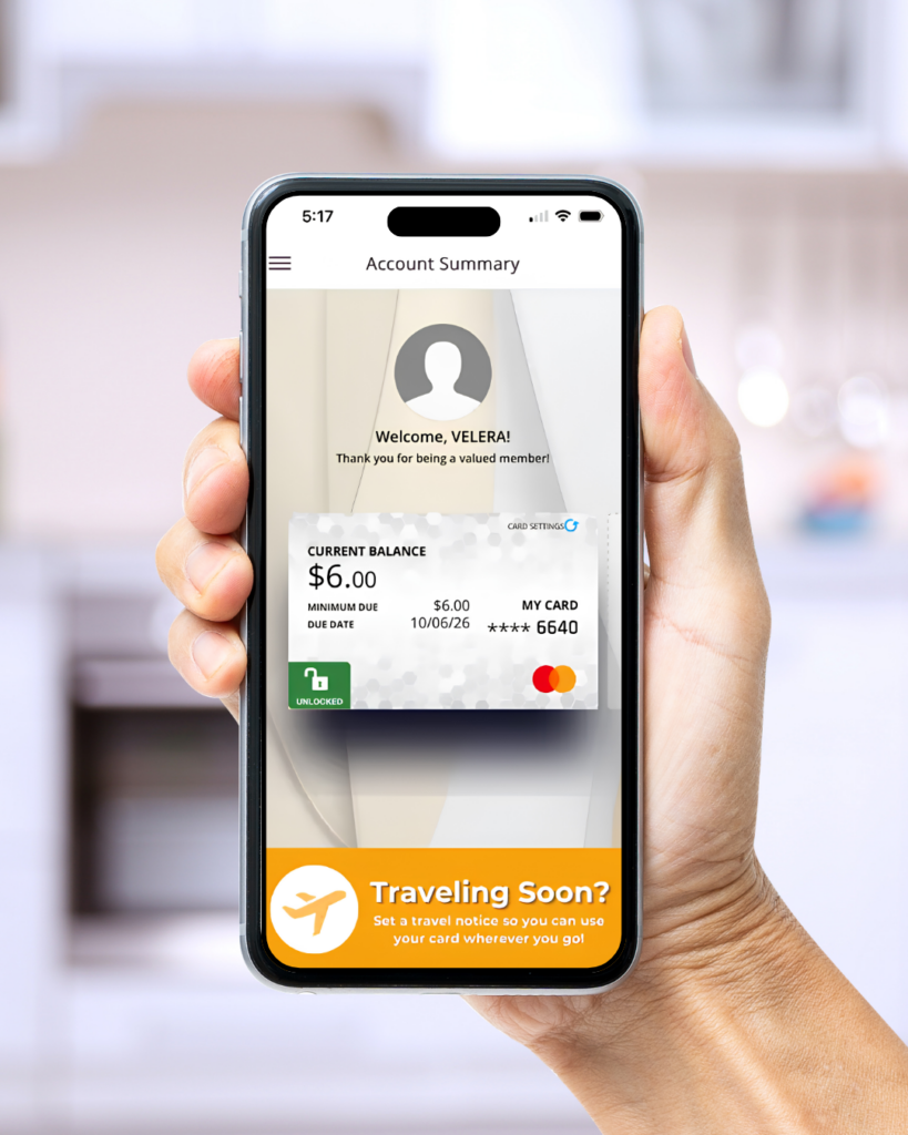 hand holding Iphone showing JCU card controls app